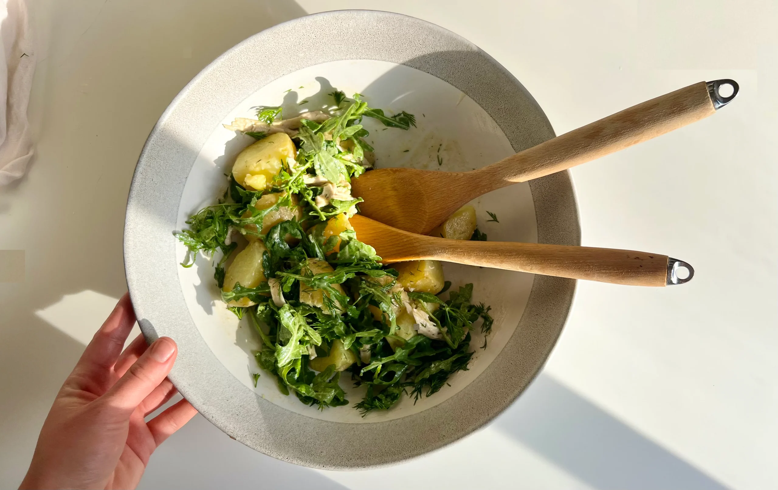 Potato, arugula and dill salad in a bowl